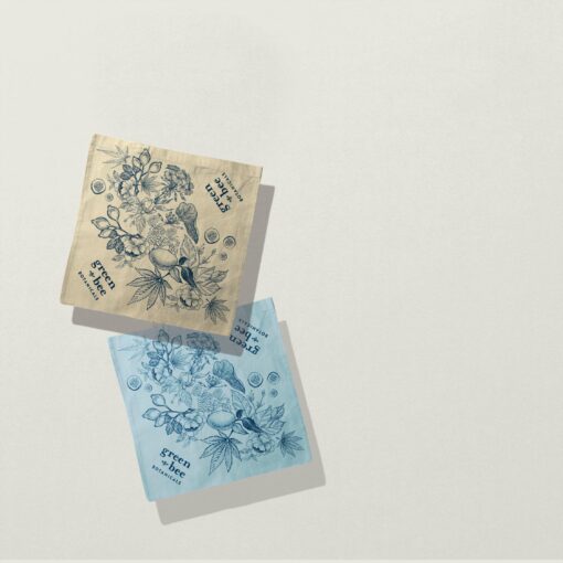 Green Bee Botanicals 100% cotton bandanas in natural and cornflower blue, with original artwork by Lilli Keinaenen.